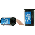 Blue and black cinestill film canisters with one showing a strip of brown photographic film emerging from its open end.