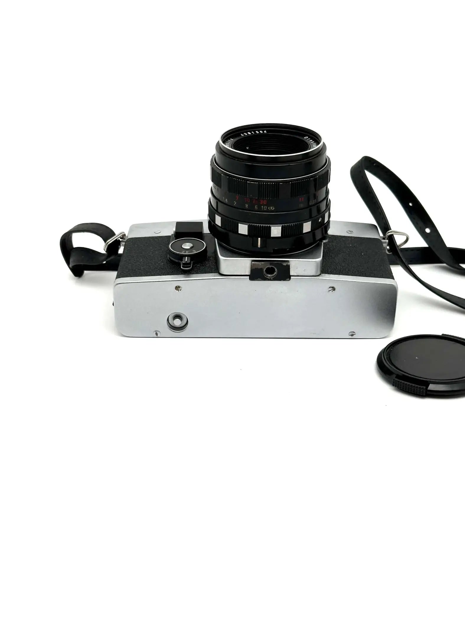 Silver and black vintage film camera with a classic rangefinder design, featuring a textured lens barrel and leather strap.