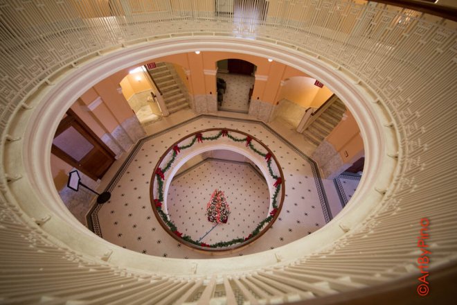 Festive red and green Christmas tree in Dancy Building atrium, Rio Grande view fullsize