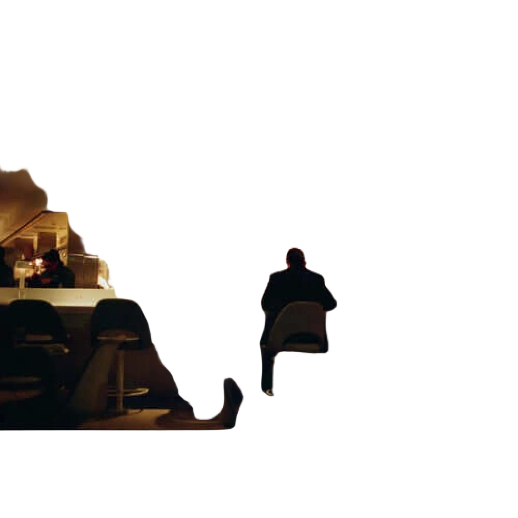 The image shows a dimly lit restaurant interior with patrons seated at bar stools, and an illuminated red ’exit’ sign above a door on the right.