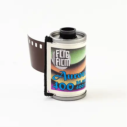 A roll of elite film aurora 400 film, featuring a colorful label with gradient hues and black perforated edges.
