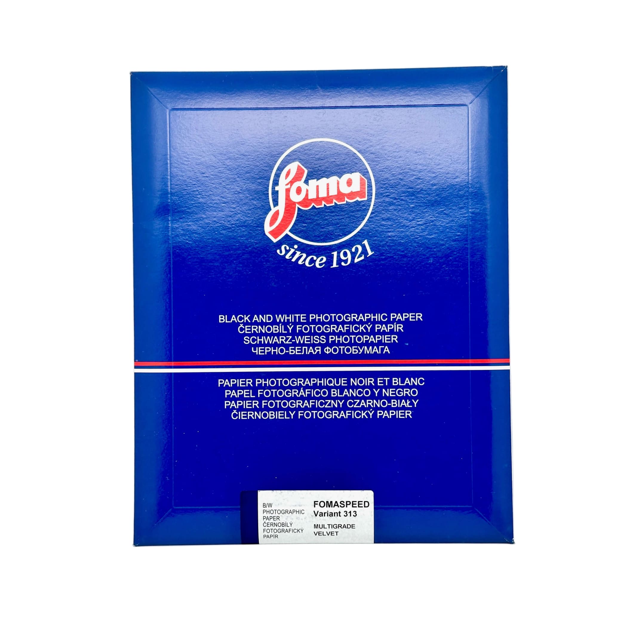 Blue foma brand box of black and white photographic paper, labeled as ’fomaspeed variant 313’’ with a multigrade velvet finish.