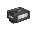 Black godox ad200 flash trigger with a textured surface and a rectangular light panel.