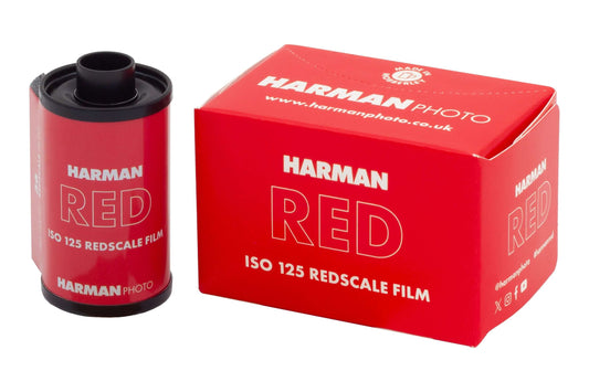 Harman Red 125 ISO Redscale 35mm film canister and packaging showcasing vibrant red design.