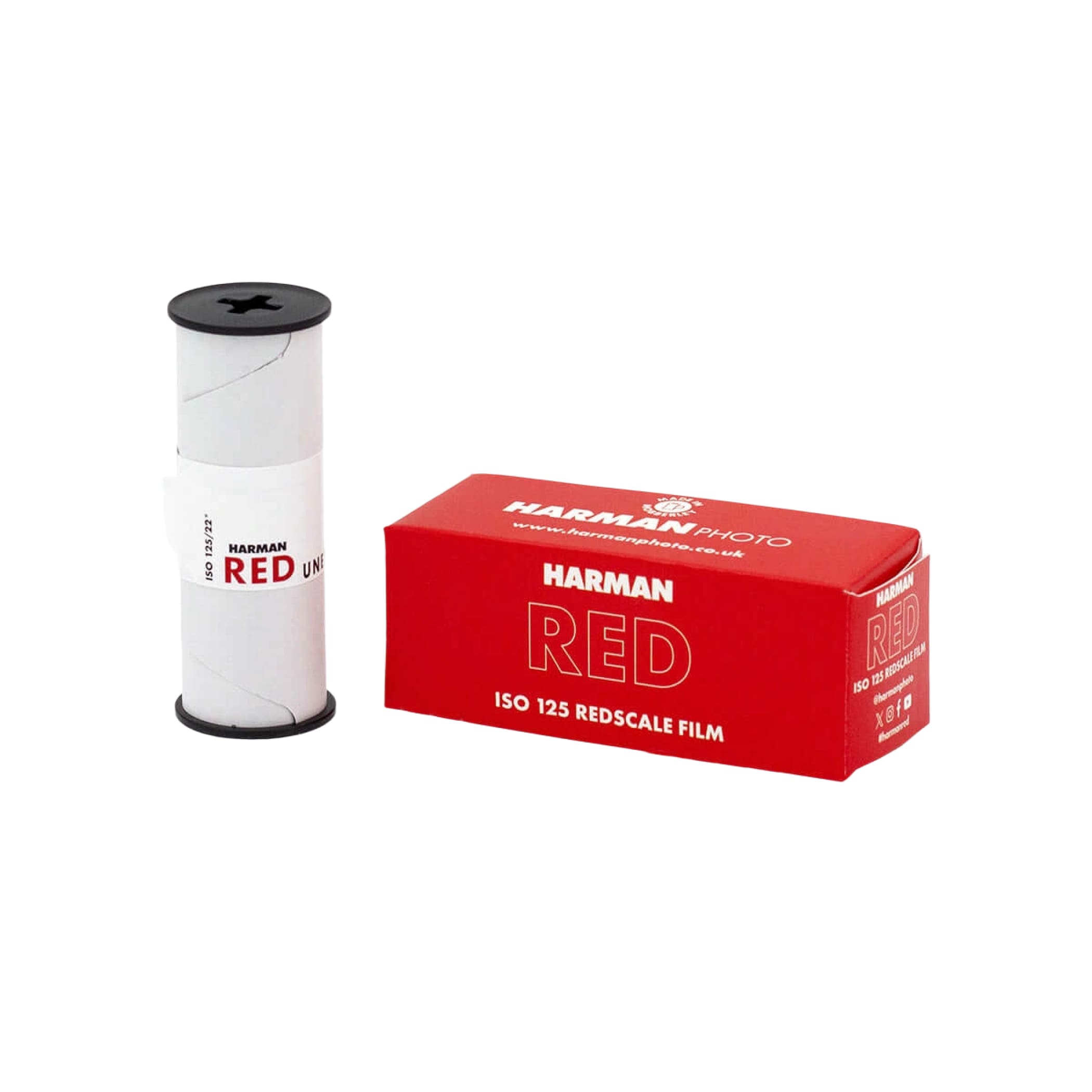 Harman red iso 125 redscales film roll in a white cylindrical canister with black caps, displayed beside its matching red retail box.