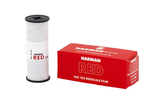 Harman Red 125 Redscale C41 120 Film roll and box showcasing vivid red packaging.