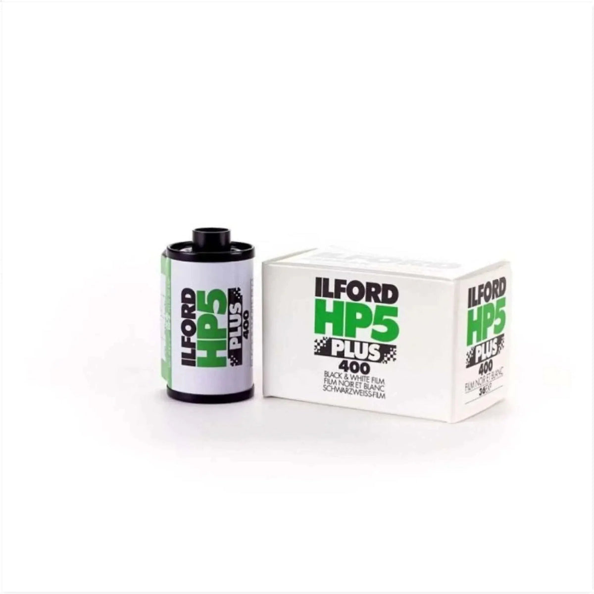 Ilford hp5 plus 400 black and white film in a cylindrical canister with green and black labeling next to its matching white box.