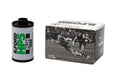 A cylindrical roll of ilford hp5 plus 400 black and white 35mm film with a green label next to its vintage football box