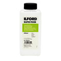 White plastic bottle with black cap, labeled ’ilford rapid fixer’ in bold black text on a green rectangular background.