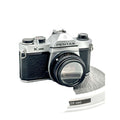 Silver and black asahi pentax k1000 film camera with a textured grip and classic rangefinder design.