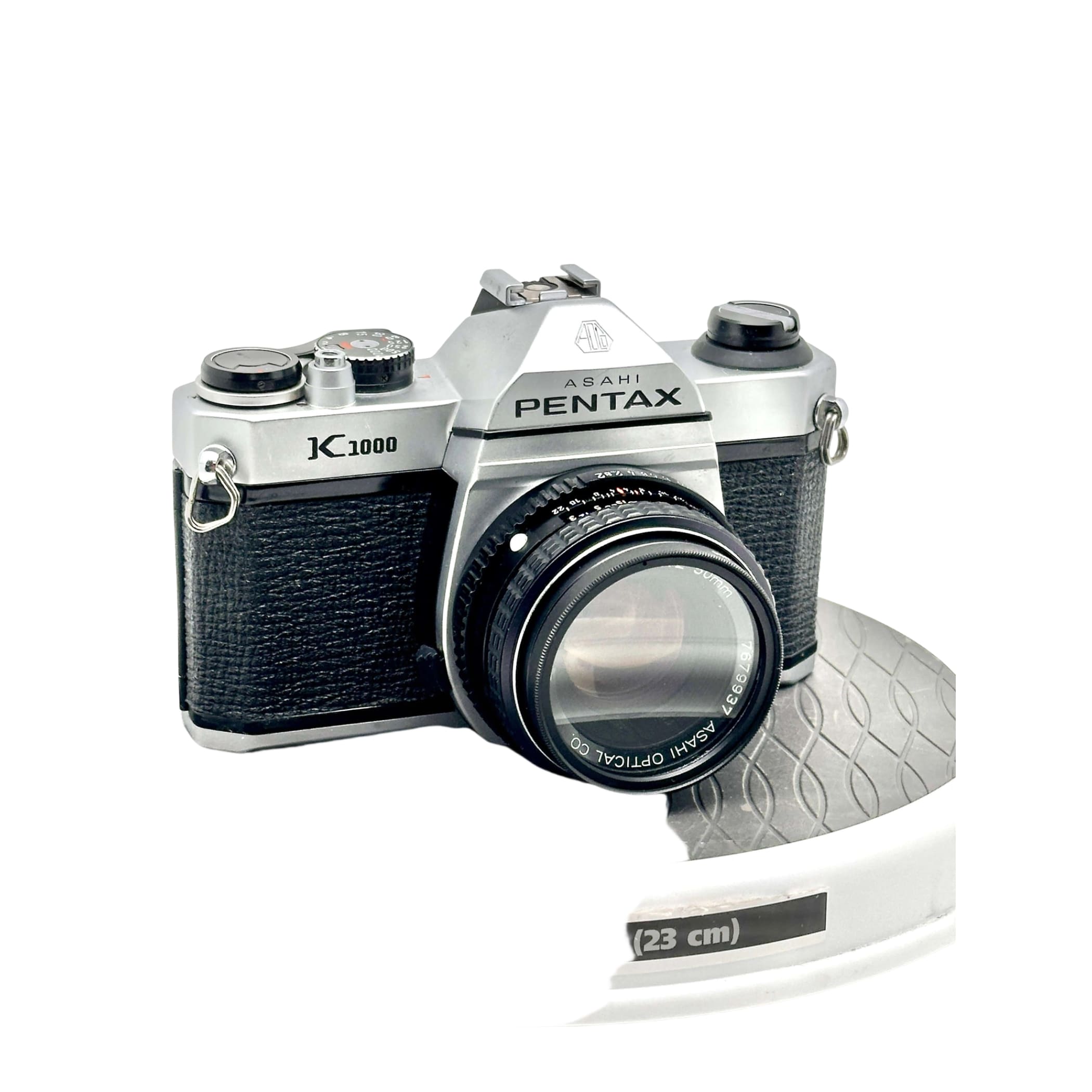 Silver and black asahi pentax k1000 film camera with a textured grip and classic rangefinder design.