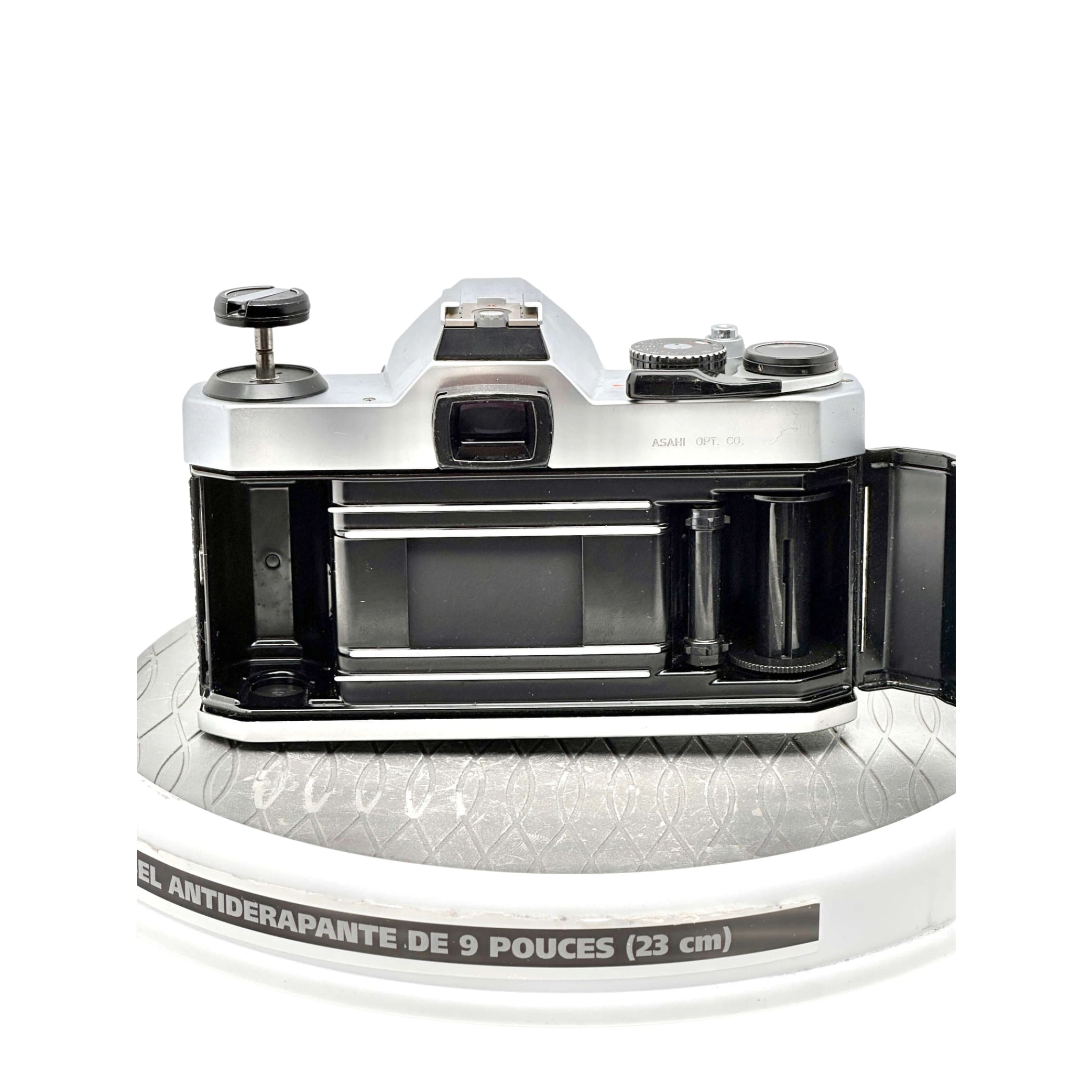 Silver and black asahi pentax k1000 film camera with a classic rangefinder design, featuring chrome accents on the dials and top plate.