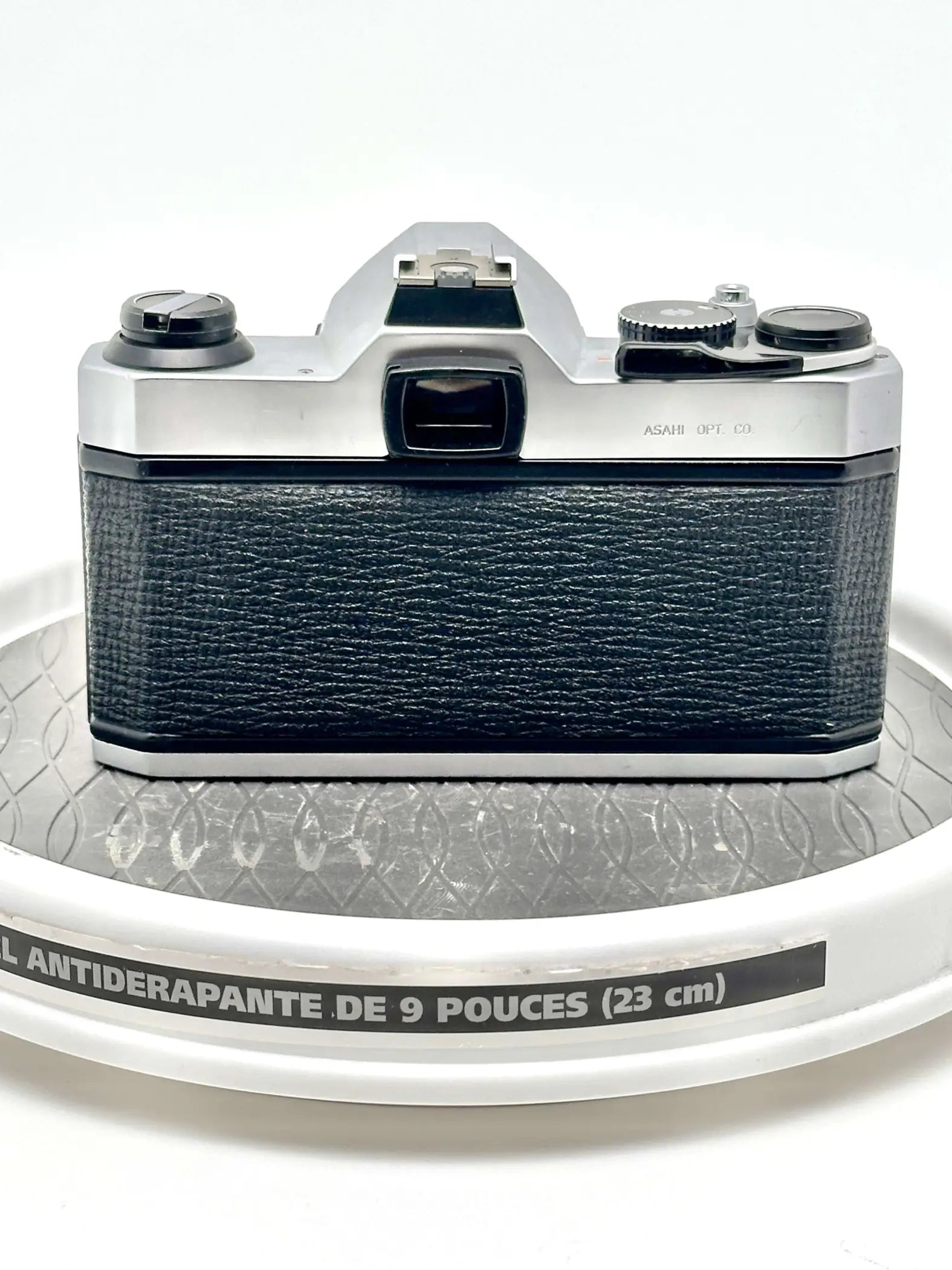 Silver and black asahi pentax 6x7 film camera with textured leather grip.