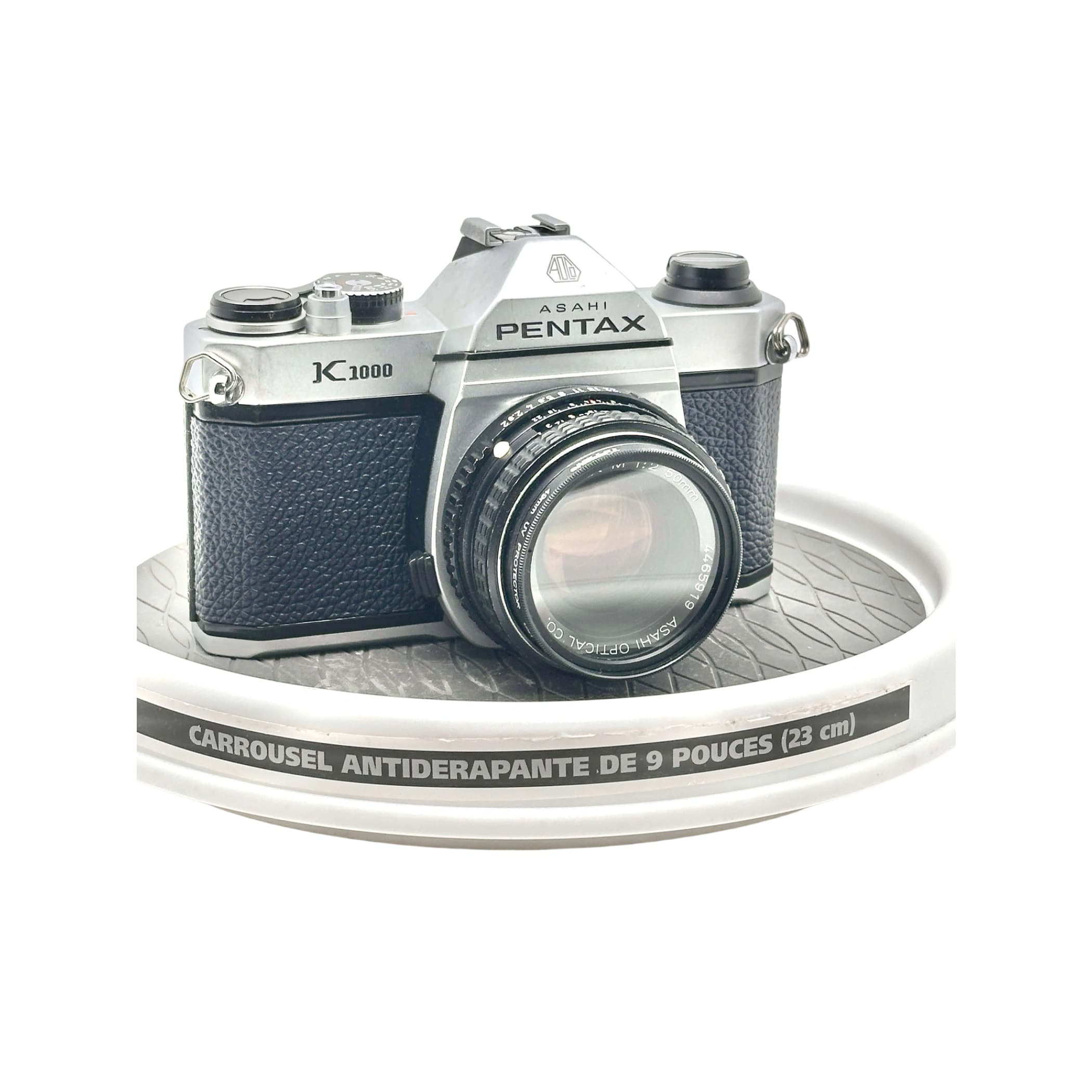 Silver and black asahi pentax k-1000 film camera with a textured leather grip.