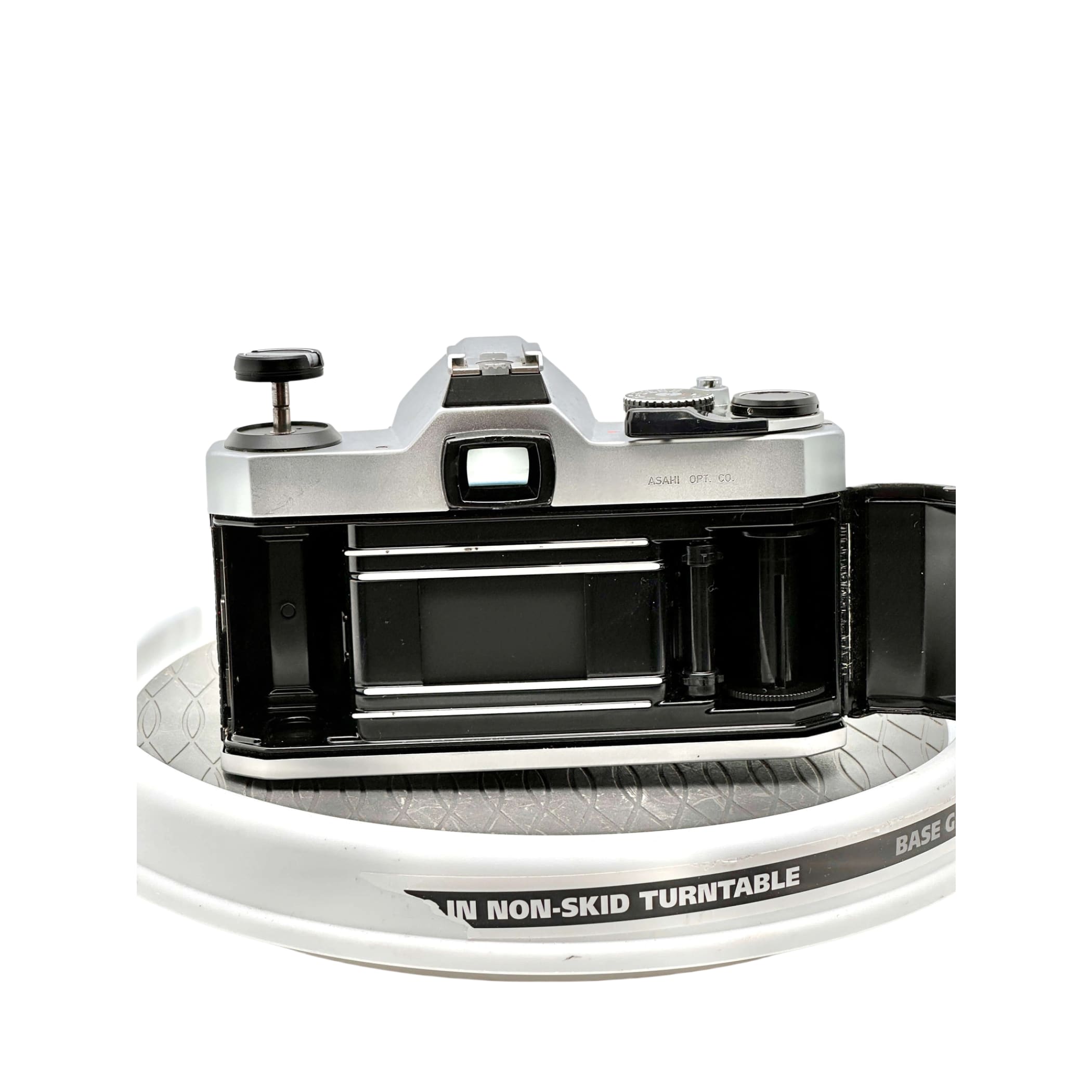 Silver-bodied canon ae-1 film camera with black accents and a visible lens mount.