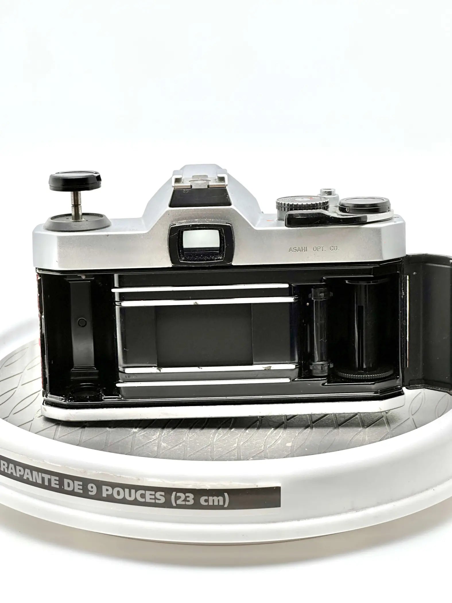 Silver-bodied, vintage asahi pentax 67 camera with black accents and a classic rangefinder design.