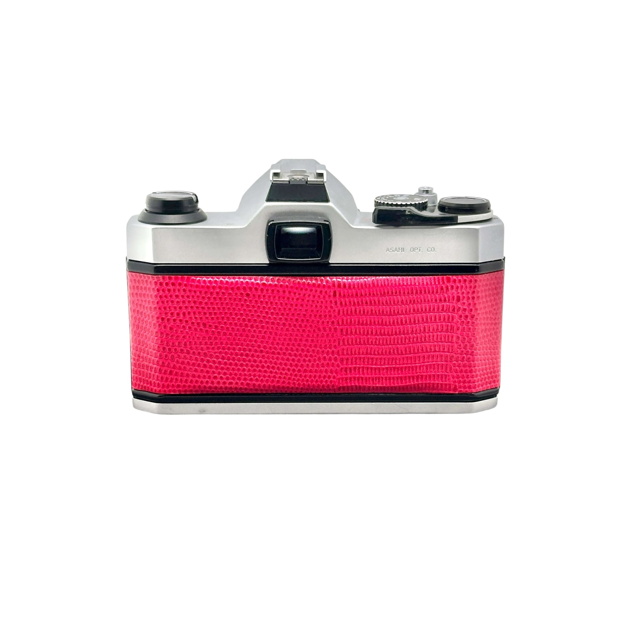A vibrant pink crocodile-patterned body with silver metallic top and side panels, featuring a classic film camera design.