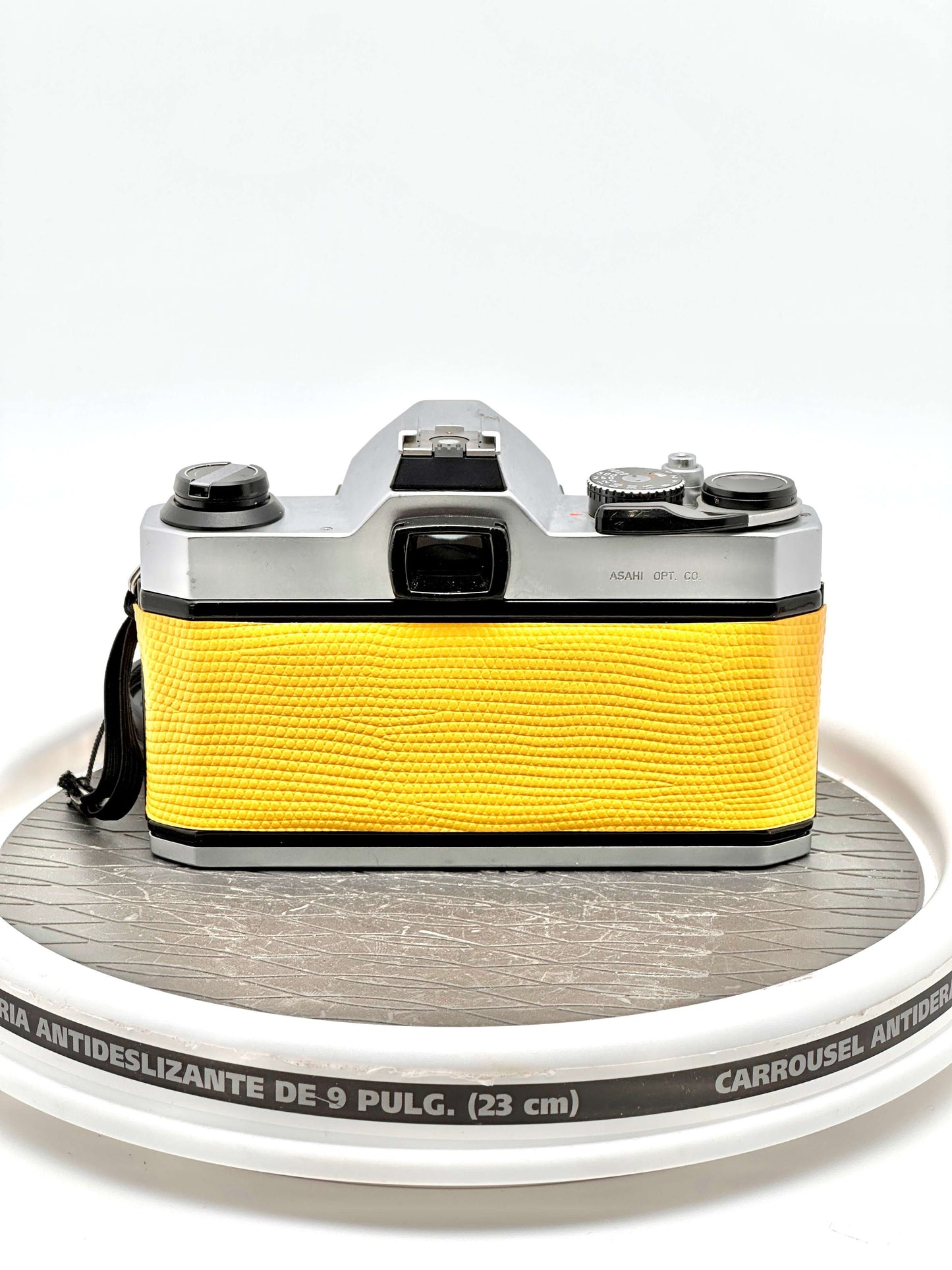 Japanese Asahi Pentax K1000 used 35mm film camera in yellow, showcasing its iconic design and reliability.