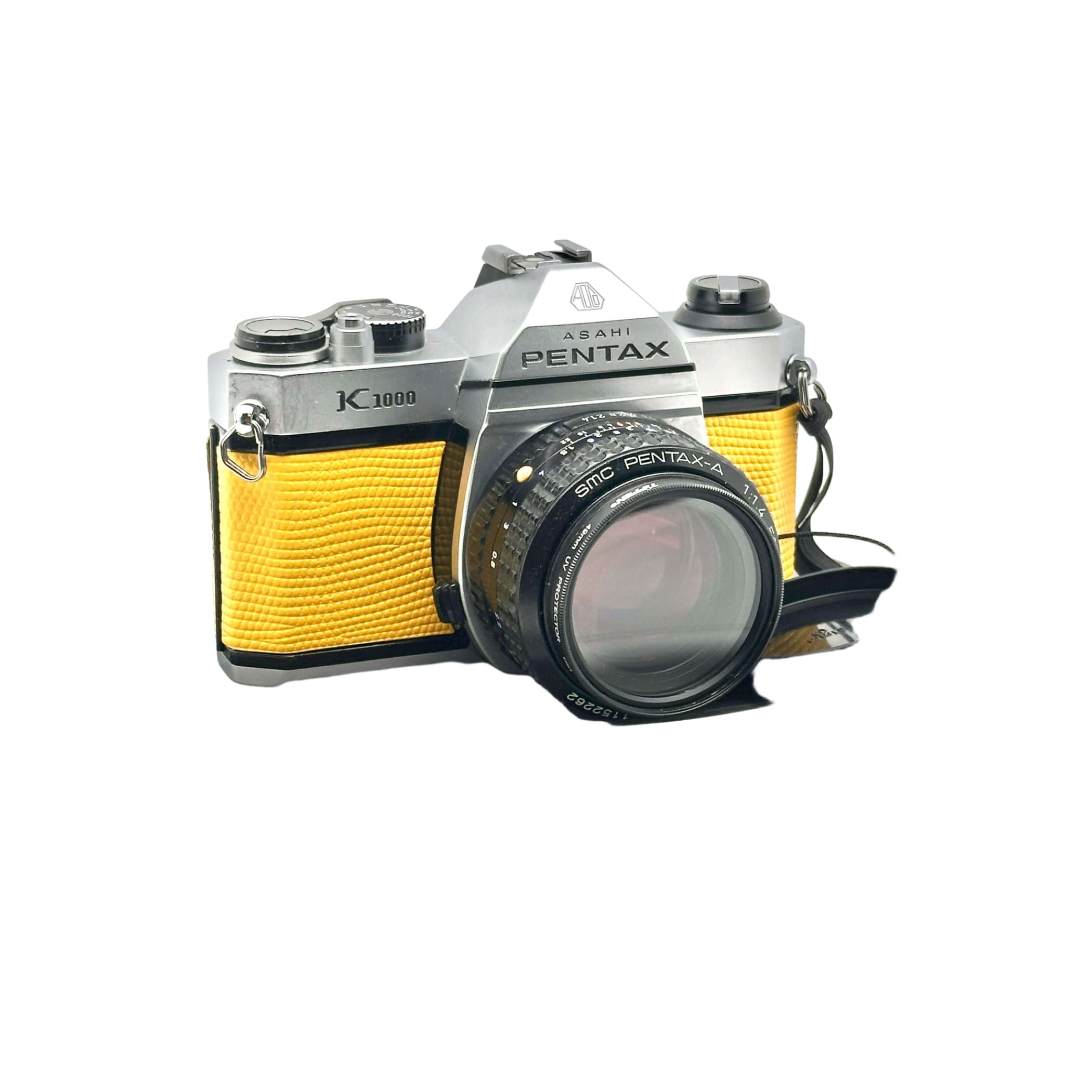 Silver and yellow asahi pentax k1000 film camera with a textured leather grip.