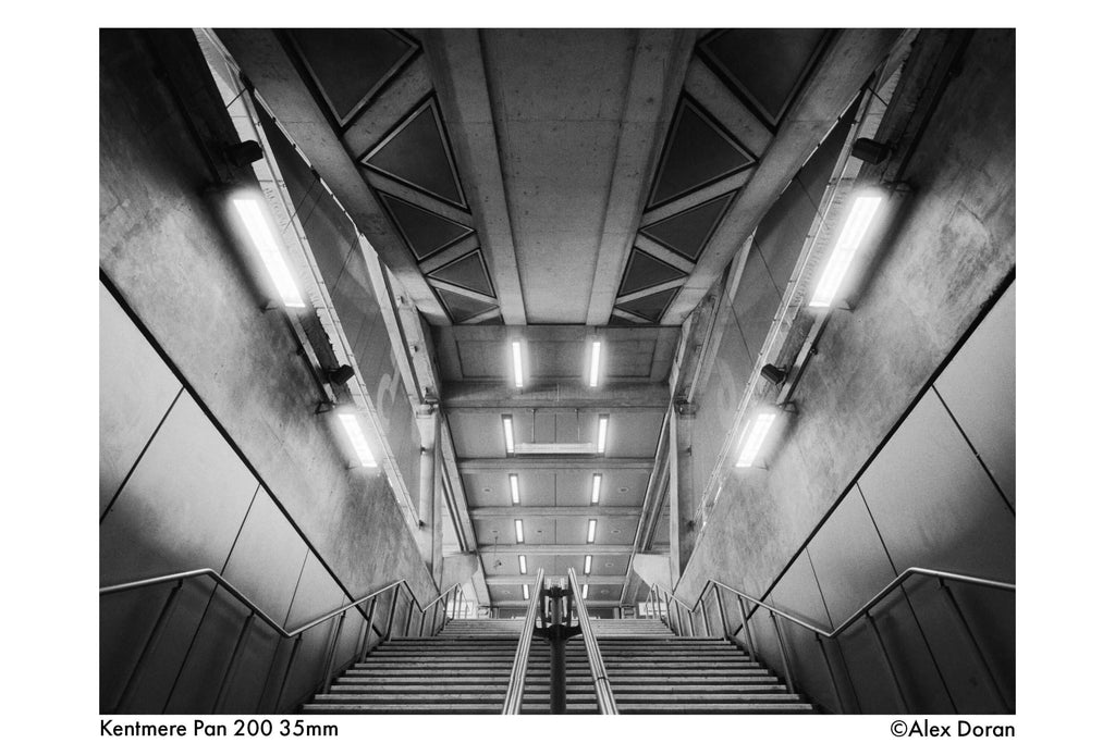 Black and white photo of stairs in a modern building, captured on Kentmere Pan 200 35mm film.