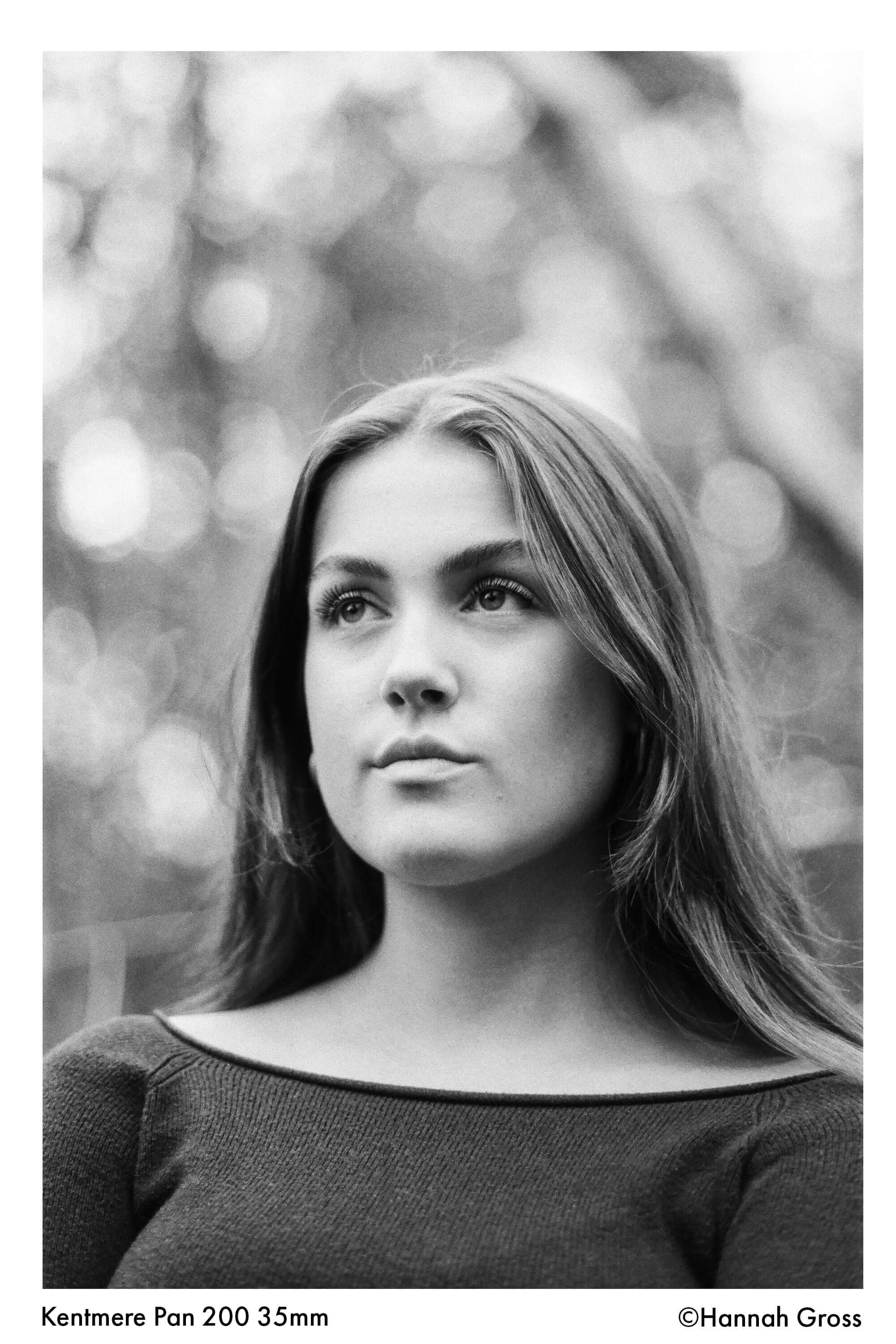 Portrait of a woman in black and white, captured on Kentmere Pan 200 35mm film, showcasing fine grain and sharpness.