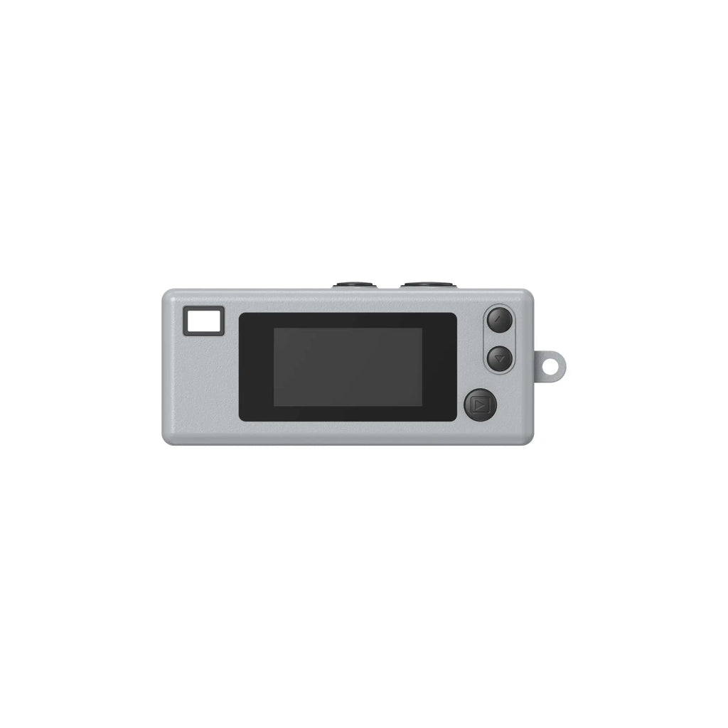 Gray rectangular digital camera with a black screen, three circular buttons on the right side, and a small square window to its left.