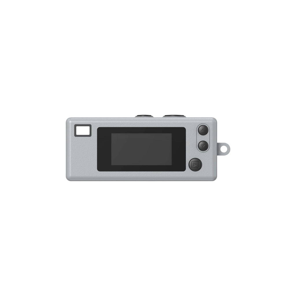 Gray rectangular digital camera with a black screen, three circular buttons on the right side, and a small square window to its left.