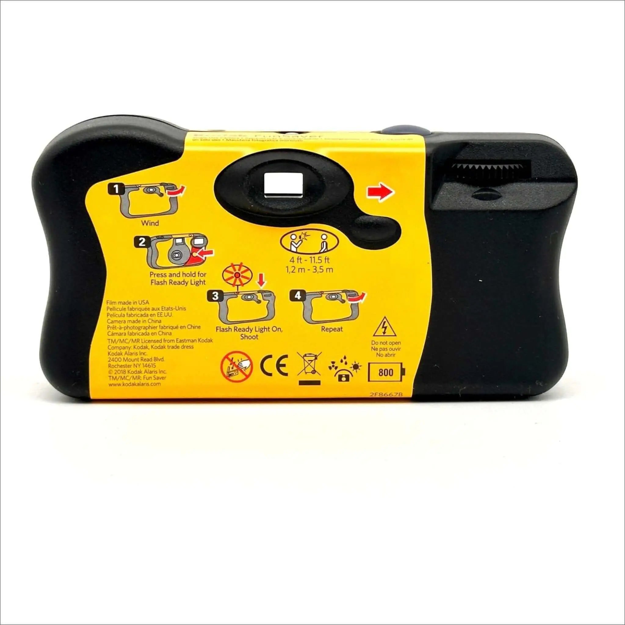 Yellow and black disposable camera with a flash-ready light feature.