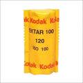Yellow kodak ektar 100 film roll, iso 100, in a classic cylindrical package with red and black text.