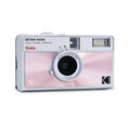 Pink and silver kodak ektar h35n half-frame camera with a 22mm aspherical lens.