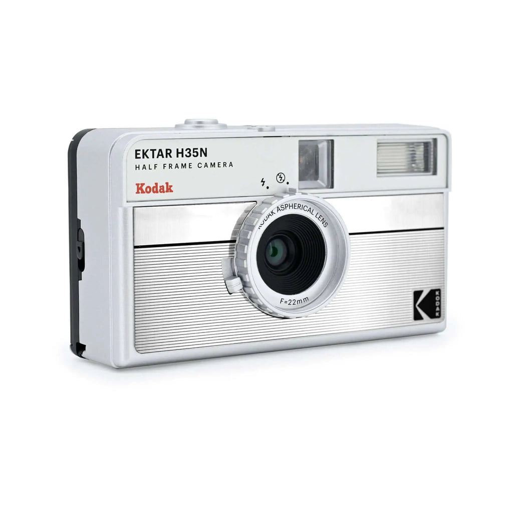 Silver kodak ektar h35n half-frame camera with a textured, ribbed body and a 22mm aspherical lens.