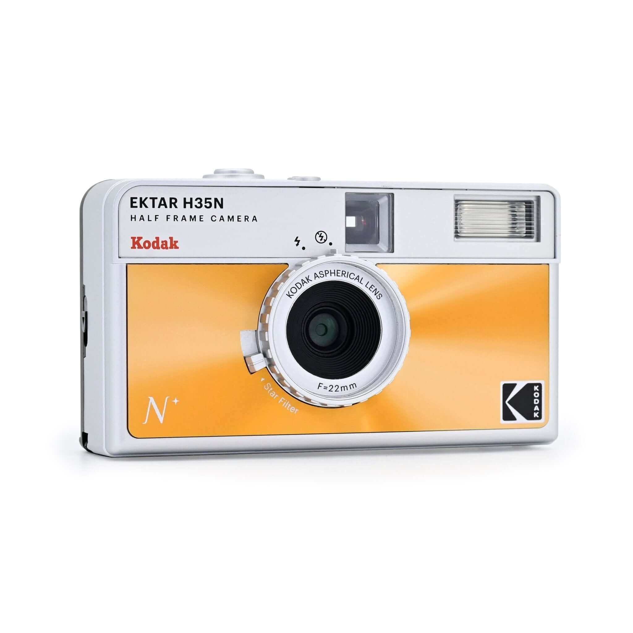 A vibrant orange and silver kodak ektar h35n half-frame camera with a circular lens marked ’kodak aspherical lens f=22mm.’