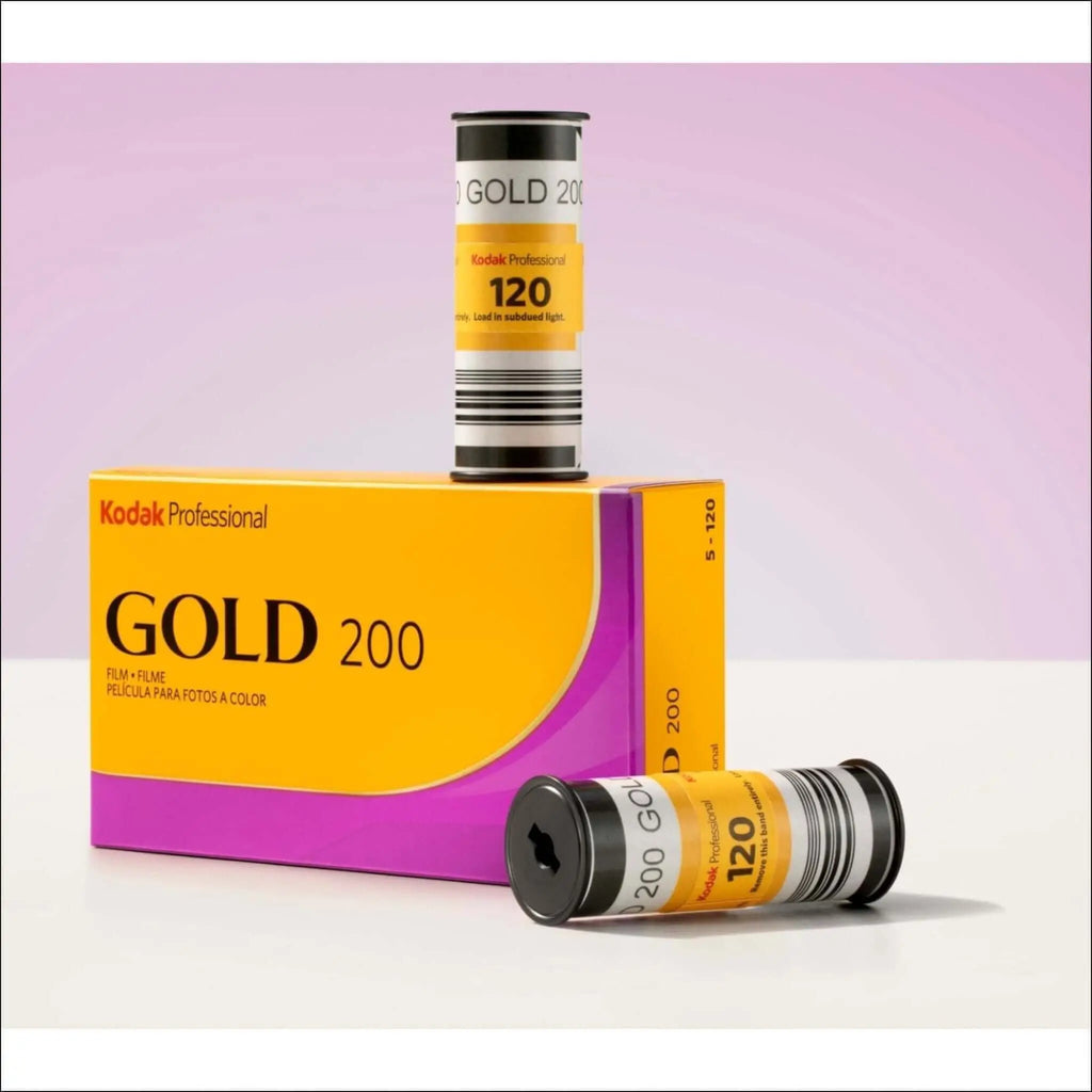 Kodak professional gold 200 color film rolls in vibrant yellow and purple packaging.