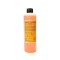 Orange liquid-filled bottle with black cap and yellow label reading ’kodak professional indicator stop bath.’