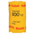 Yellow kodak portra 800 film roll, iso 800, in a distinctive yellow and red branded wrapper.