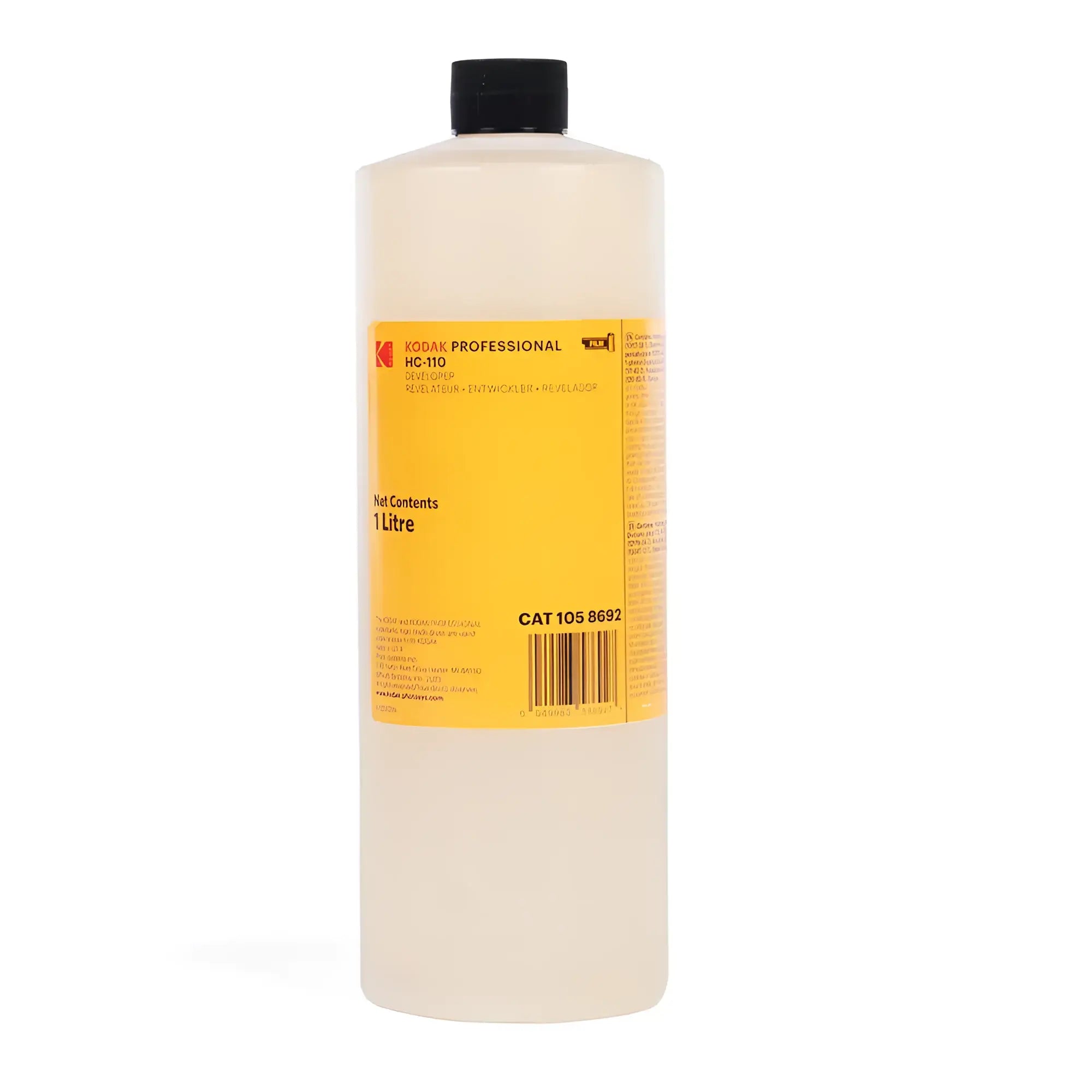 A translucent, off-white liquid-filled bottle with a black cap and a bright yellow label that reads ’kodak professional hc-110’’ and indicates 1 litre net contents.