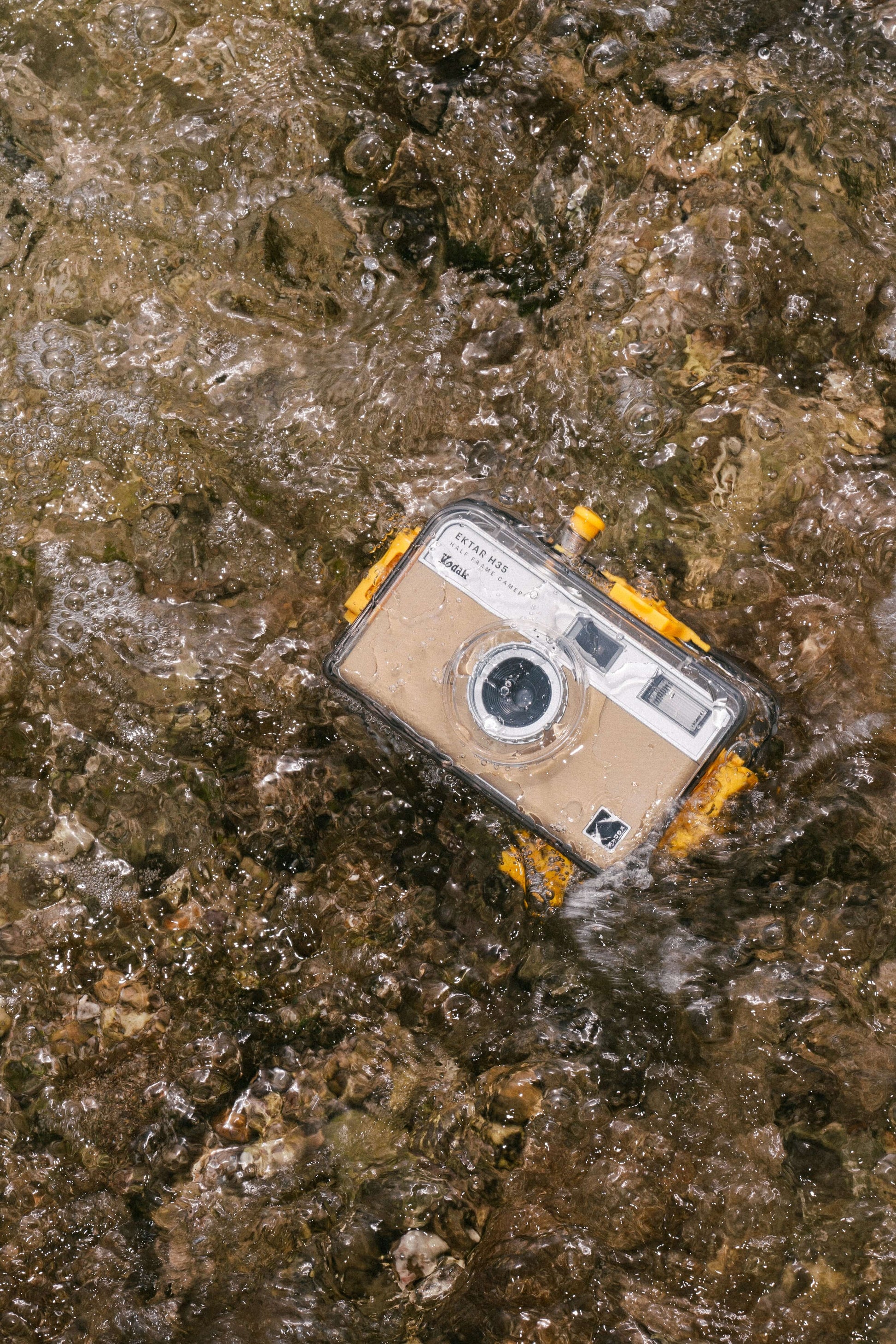 Kodak Ektar H35N underwater case floating in clear water, designed for underwater photography adventures.