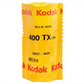 A bright yellow kodak tri-x 400 film roll in its original packaging, labeled with black and red text.