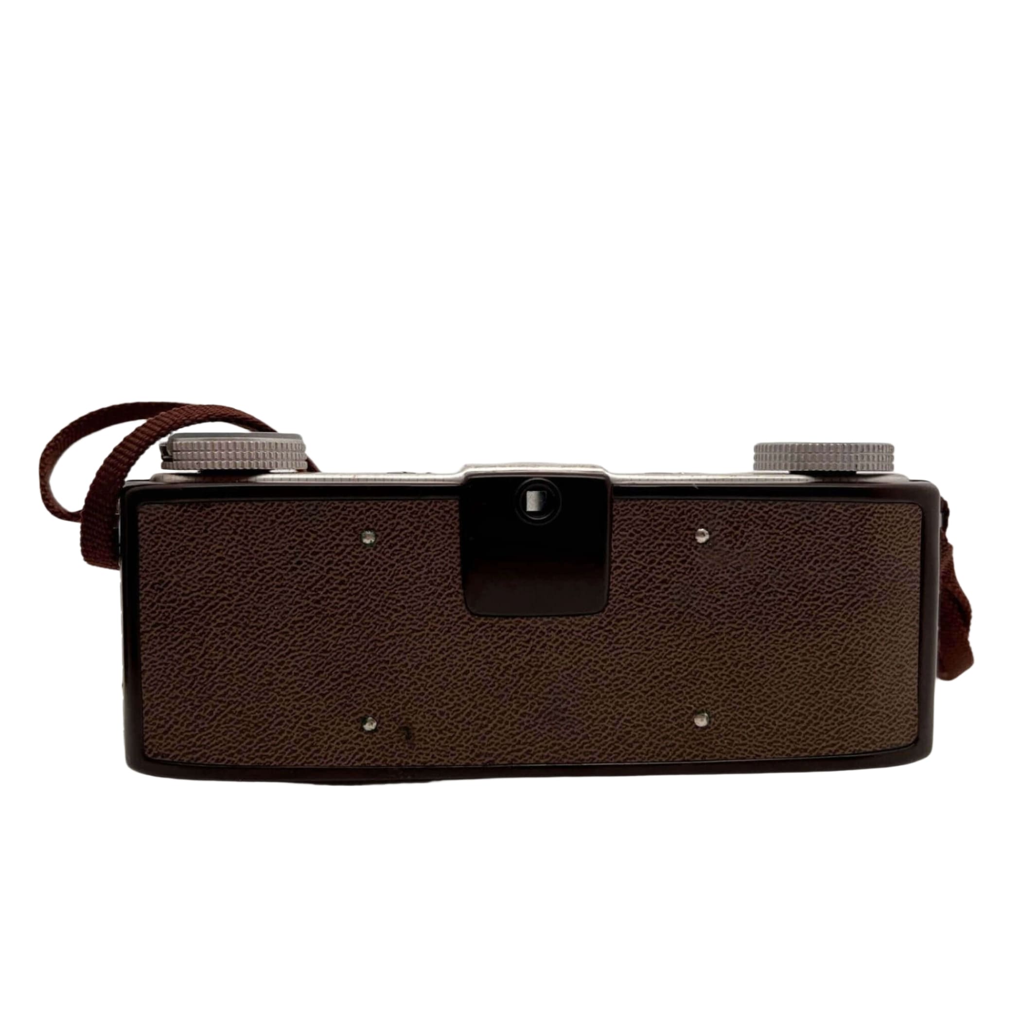 Brown textured leather-bodied vintage camera with silver metal dials and a matching brown strap.