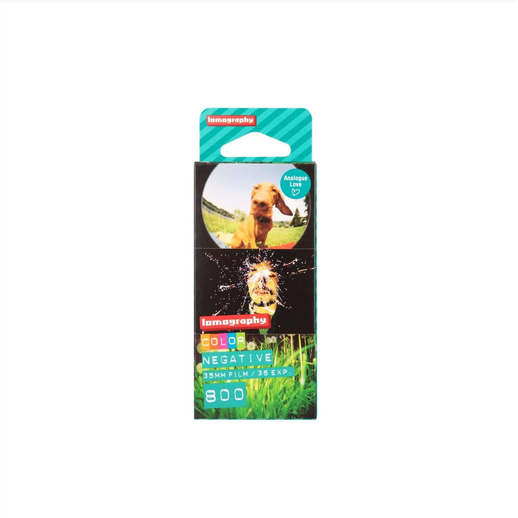 Lomography color negative 35mm film pack with vibrant green and black packaging featuring a dog photo on the front.