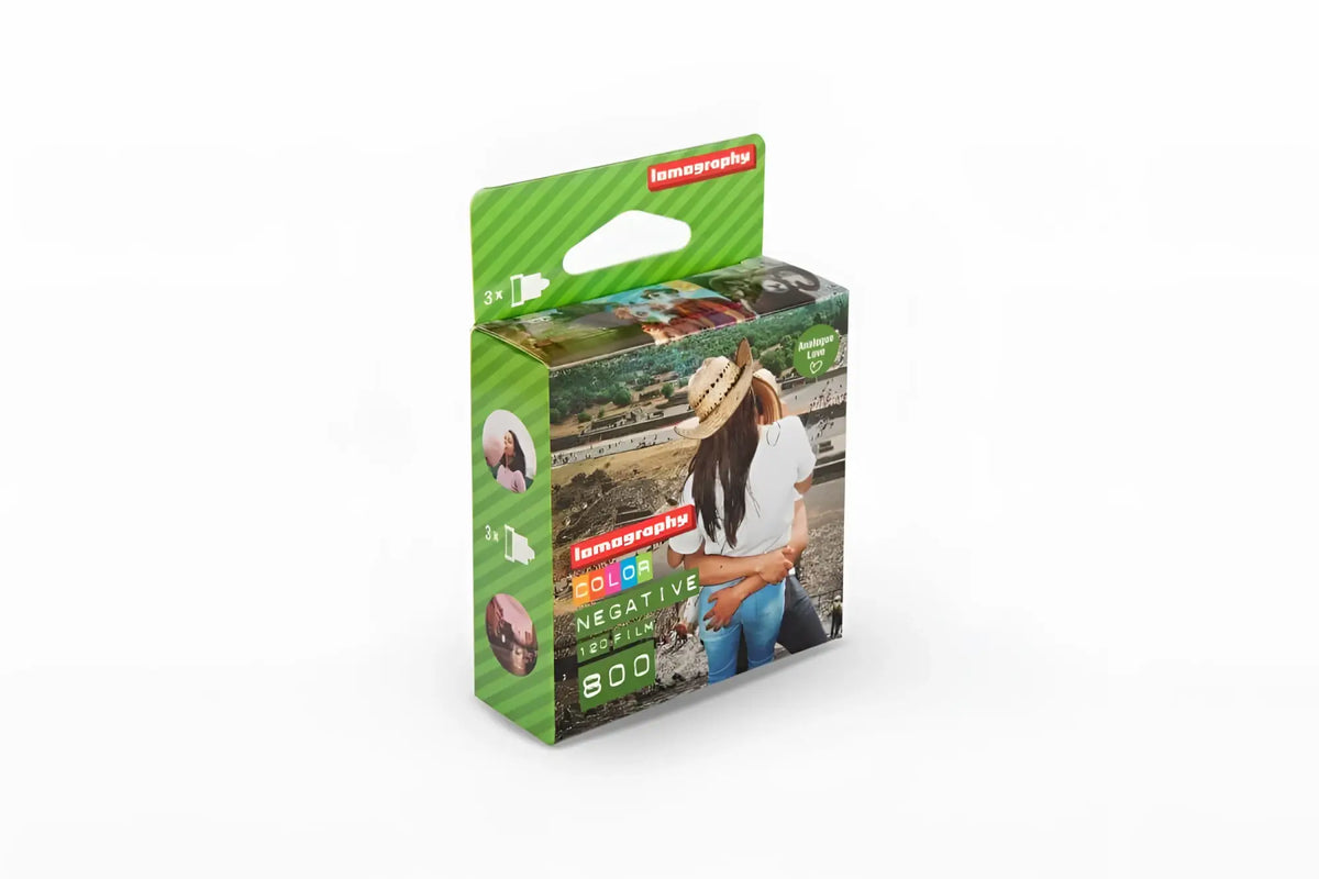 Green lomography color negative 800 film pack with a photo of two people on the box.