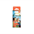 Lomography color negative 35mm film, 100 iso, packaged in a vibrant orange and colorful cardboard box with images of people and an amusement park ride.