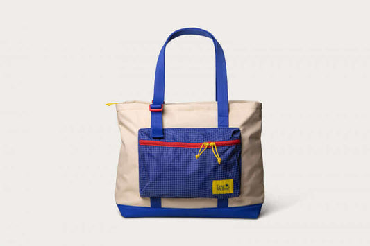 Long Weekend Beacon Tote in creme-multi with blue accents, zippered compartments, perfect for travel and everyday essentials.
