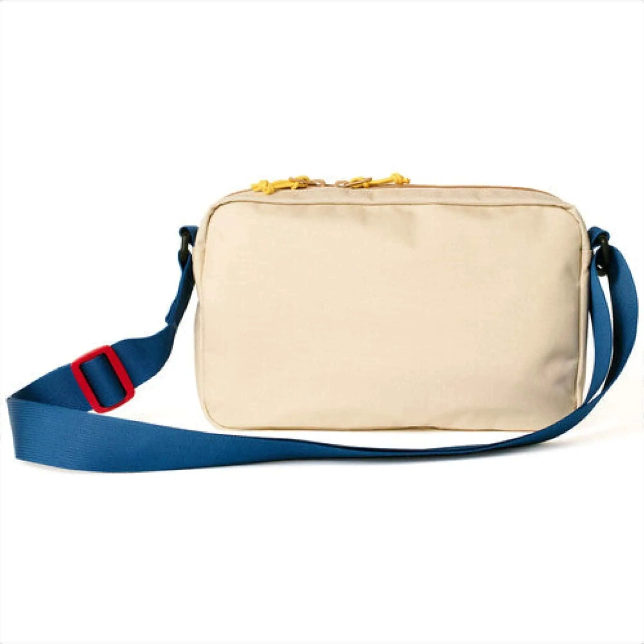 Beige nylon crossbody bag with a blue strap and red buckle, featuring yellow zipper pulls.
