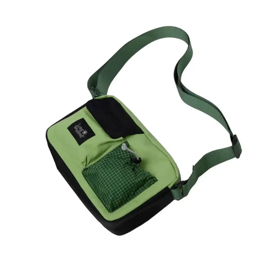 Long Weekend Santa Fe Camera Bag in moss green with adjustable strap and front pocket for accessories.