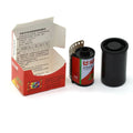 Red and green labeled 36-exposure color film canister with black plastic cap.