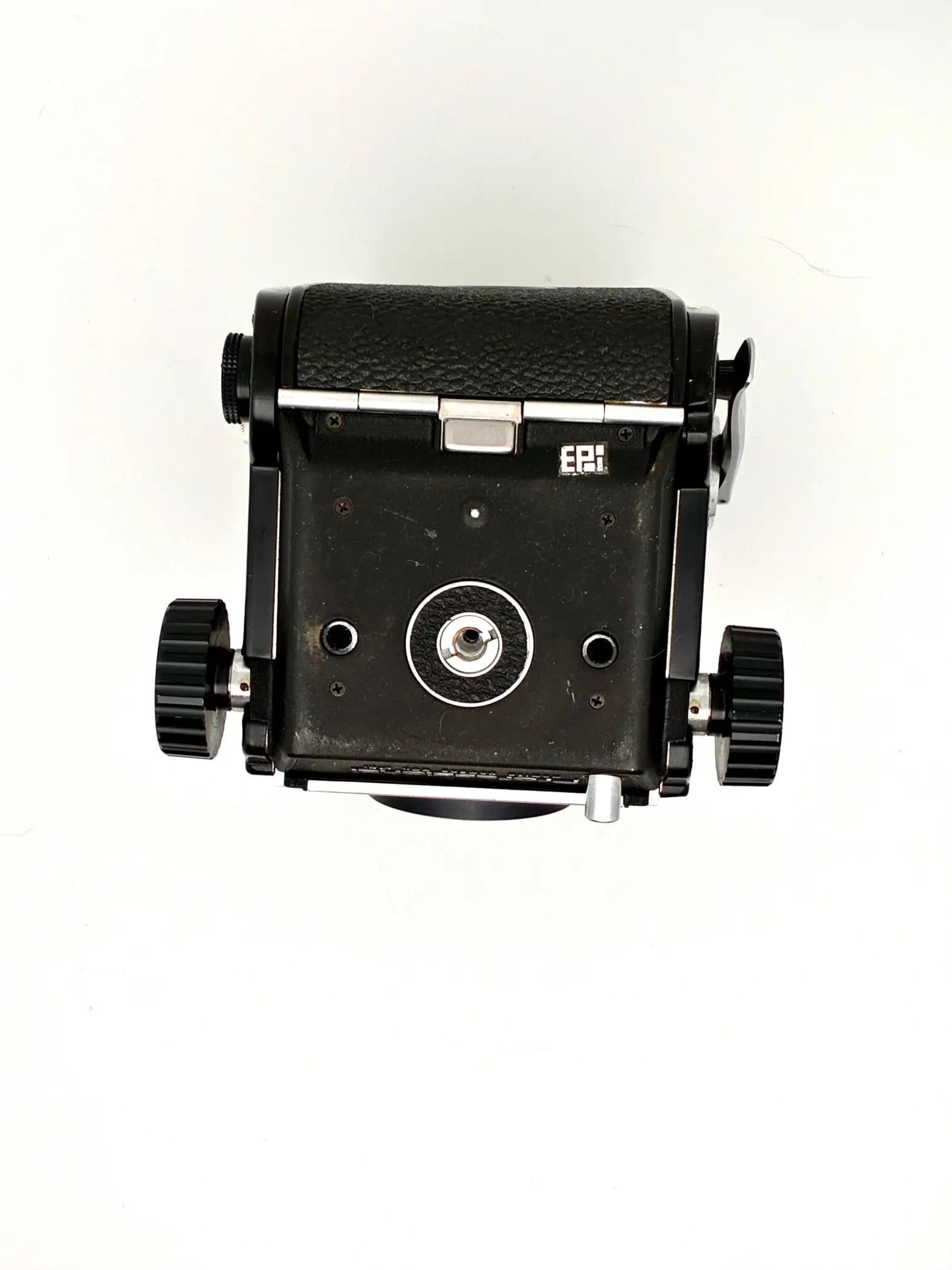 Vintage camera lens with brand logo on a white background