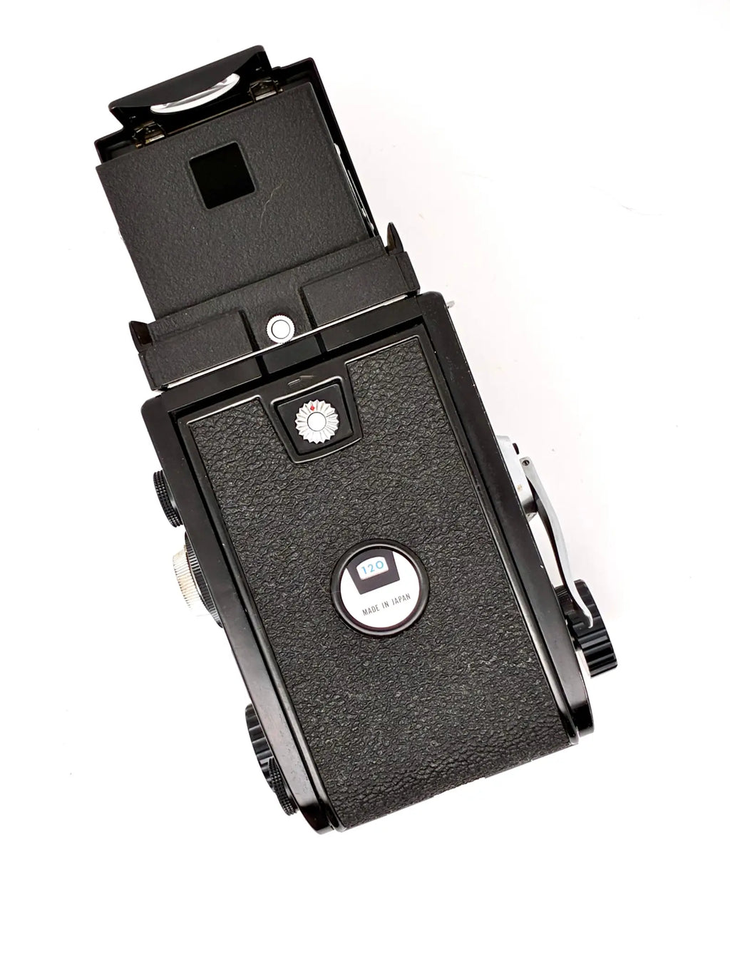 Vintage camera with a prominent lens on a white background