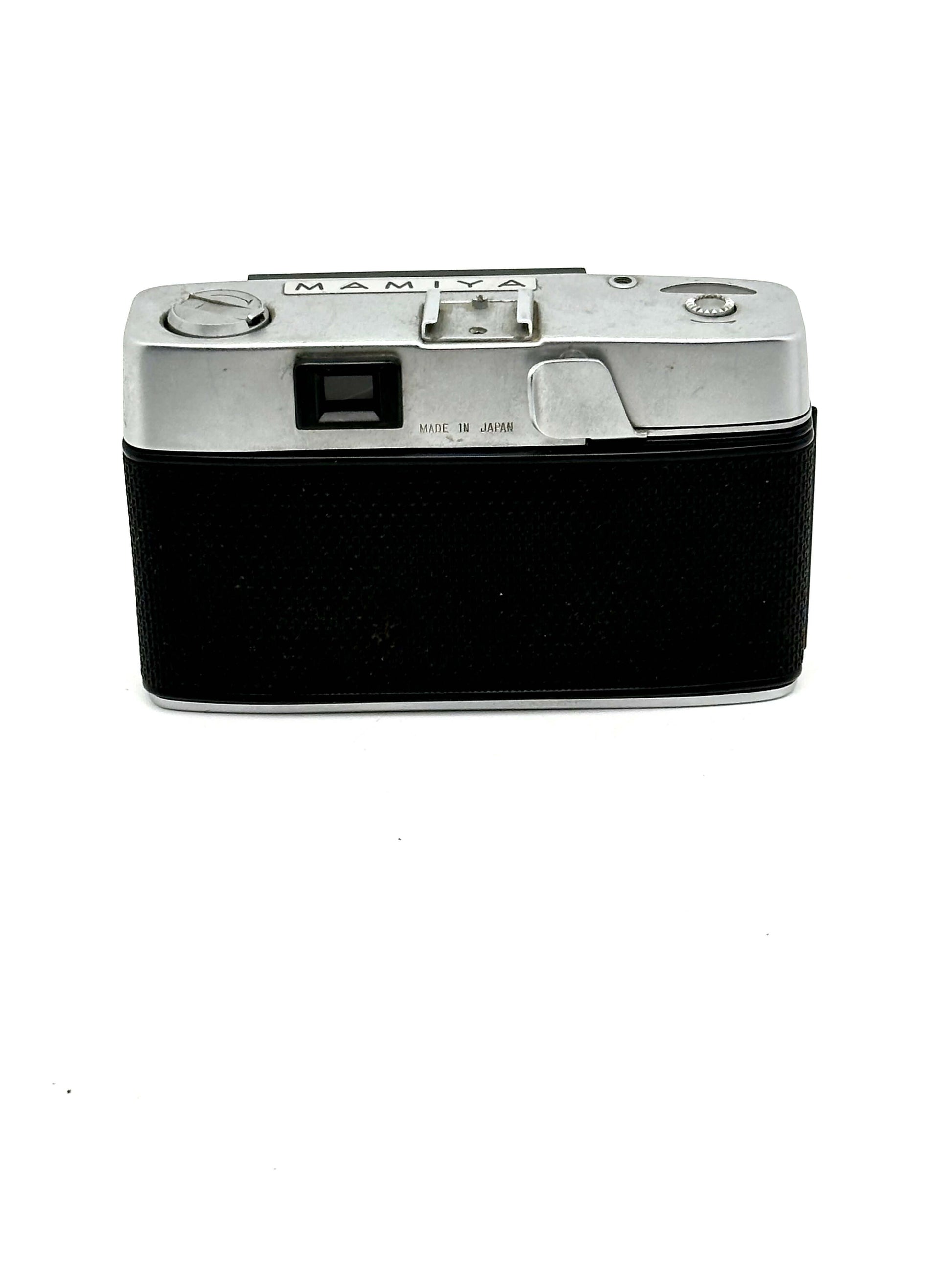 Mamiya Kominar vintage rangefinder 35mm film camera with black body and silver accents.
