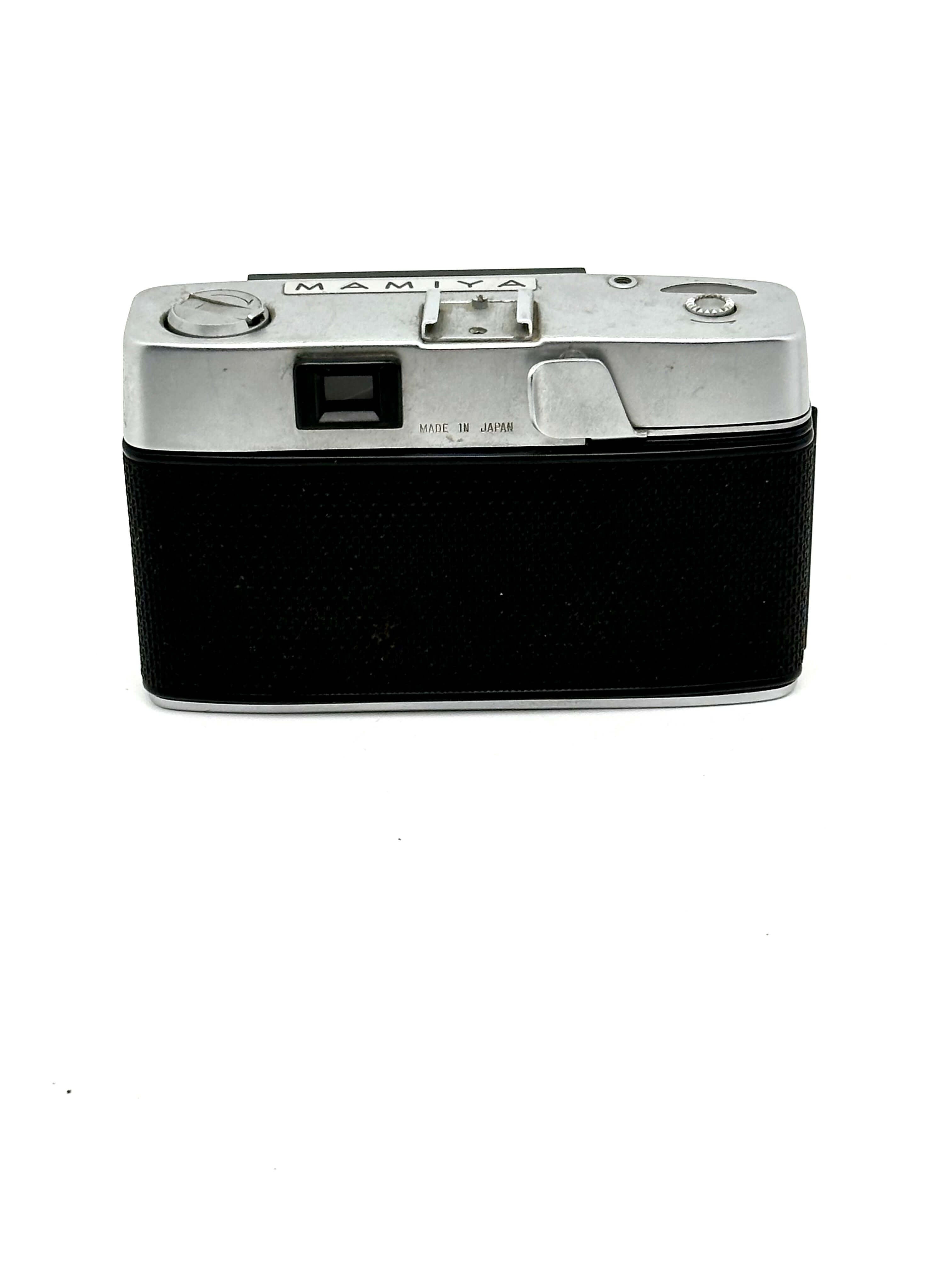 Mamiya Kominar vintage rangefinder 35mm film camera with black body and silver accents.